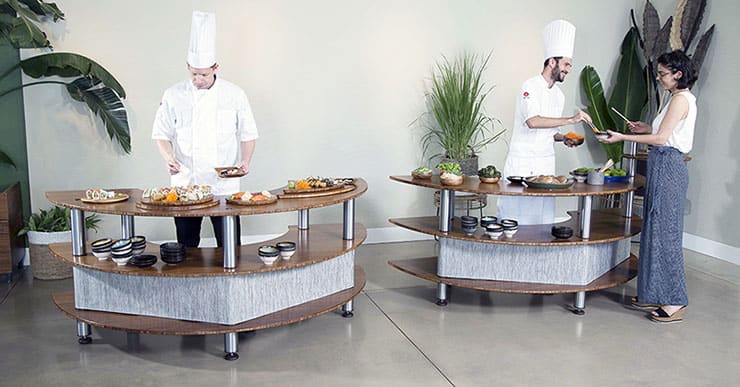 Chefs interacting with guest in buffet 