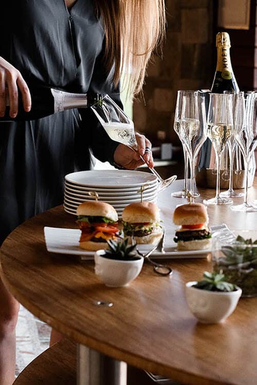 burgers and champagne on buffet