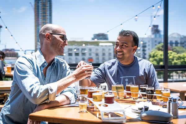 People enjoying beer tasting display