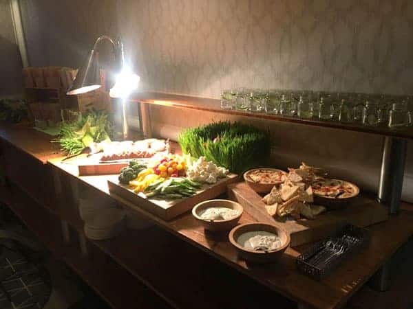 table with vegetables and hummus